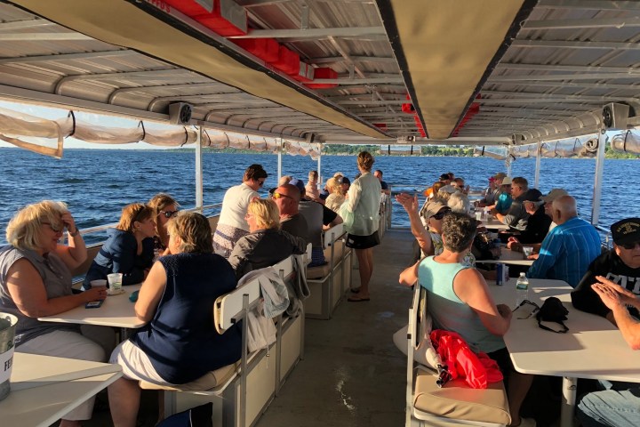 a group of people sitting on a boat