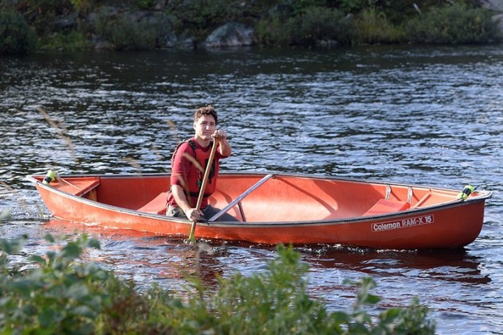 a small boat in a body of water