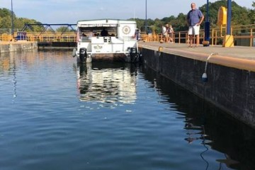 a boat is docked next to a body of water